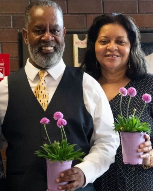 mills family holding flowers